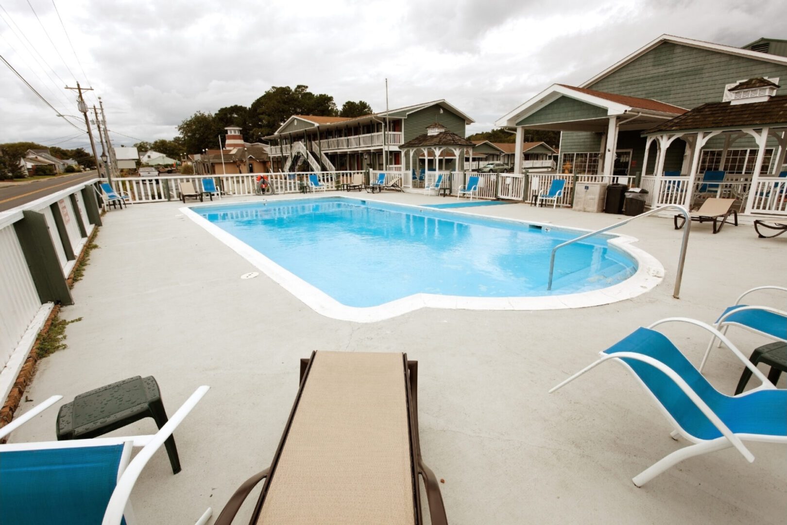 Hotel pool under stormy sky. Horizontal.