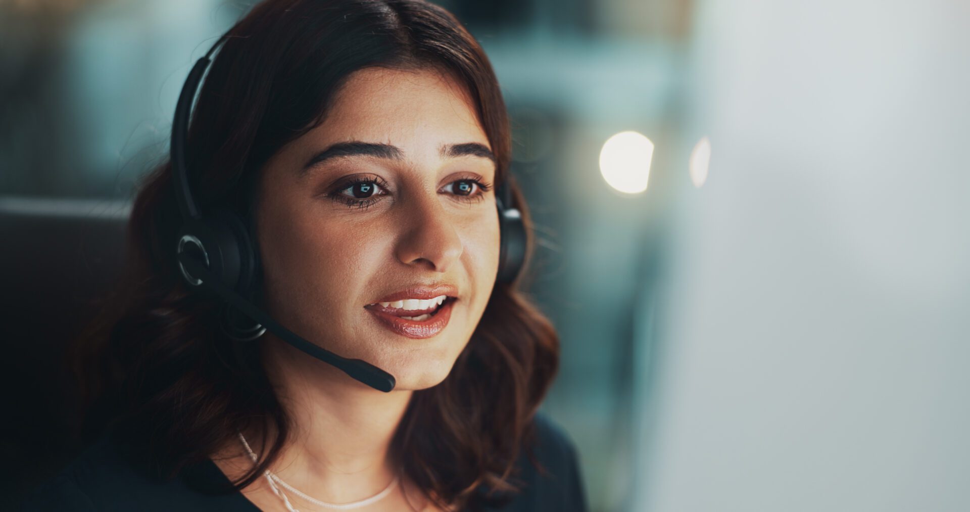 Customer service, computer and woman in office at night for international technical support consultation online. Headset, tech and call center agent with multilingual translation for global client.